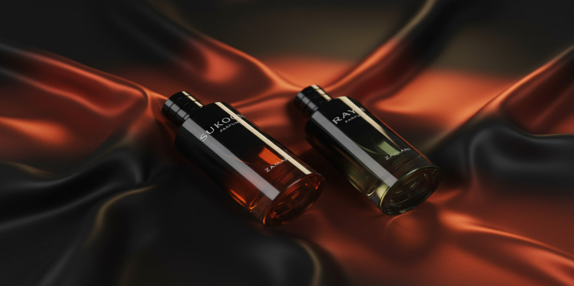Zamani fragrance bottles on a dark, textured fabric background