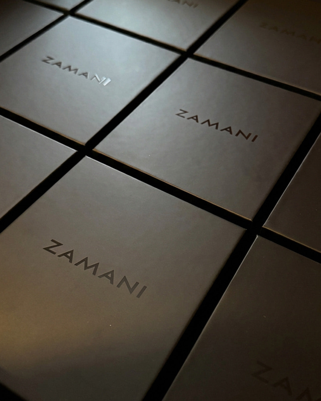 Close-up of ZAMANI packaging with a grid pattern